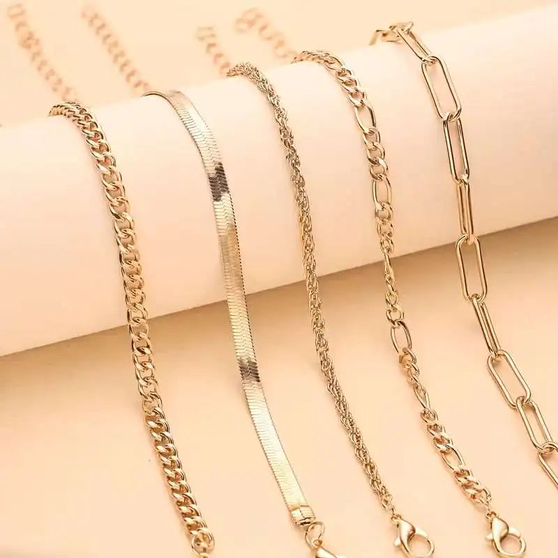 Gold Bracelet Set – 5-piece set, featuring a Cuban chain, bow-tie chain, and simple bracelets. Perfect for everyday wear and gifts, punk-style jewelry collection. Ideal for autumn and winter accessories. Perfect for parties