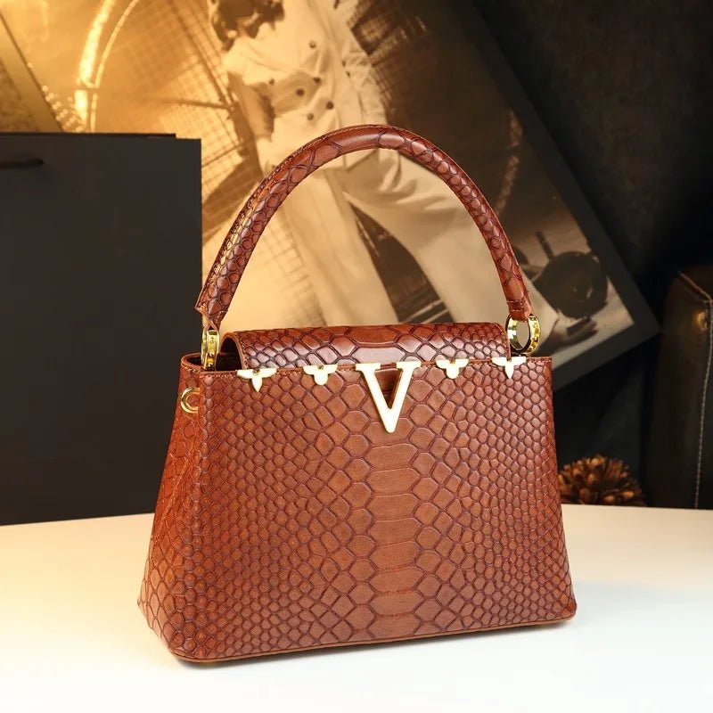 fashionable and versatile handbag with a high - end feel. It's a niche bag for middle - aged moms to carry diagonally - Kenner House Emporium