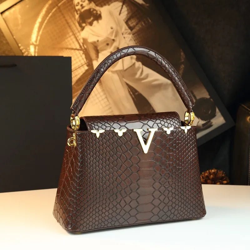 fashionable and versatile handbag with a high - end feel. It's a niche bag for middle - aged moms to carry diagonally - Kenner House Emporium