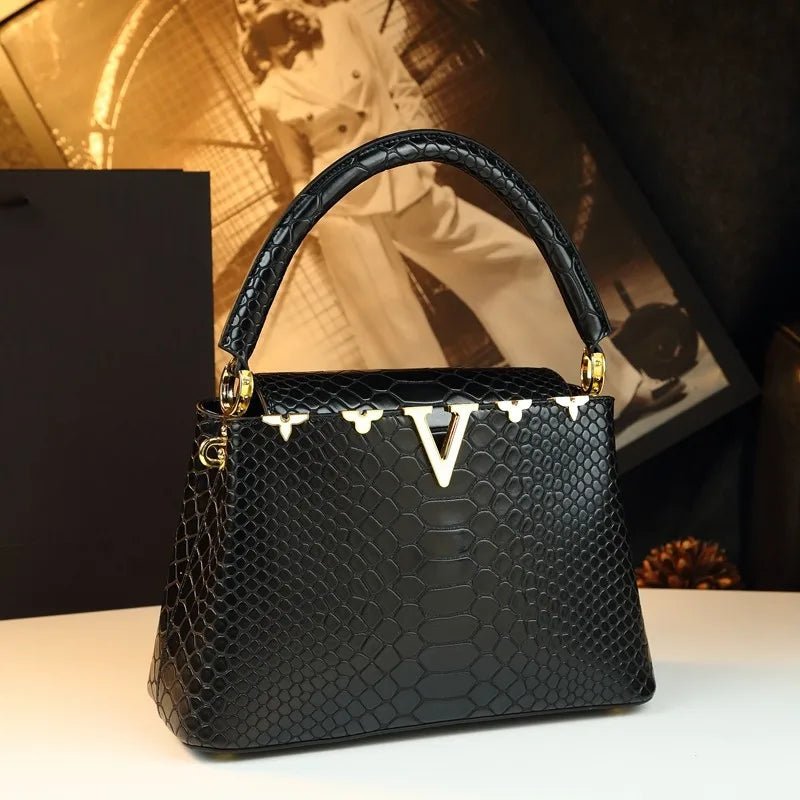 fashionable and versatile handbag with a high - end feel. It's a niche bag for middle - aged moms to carry diagonally - Kenner House Emporium