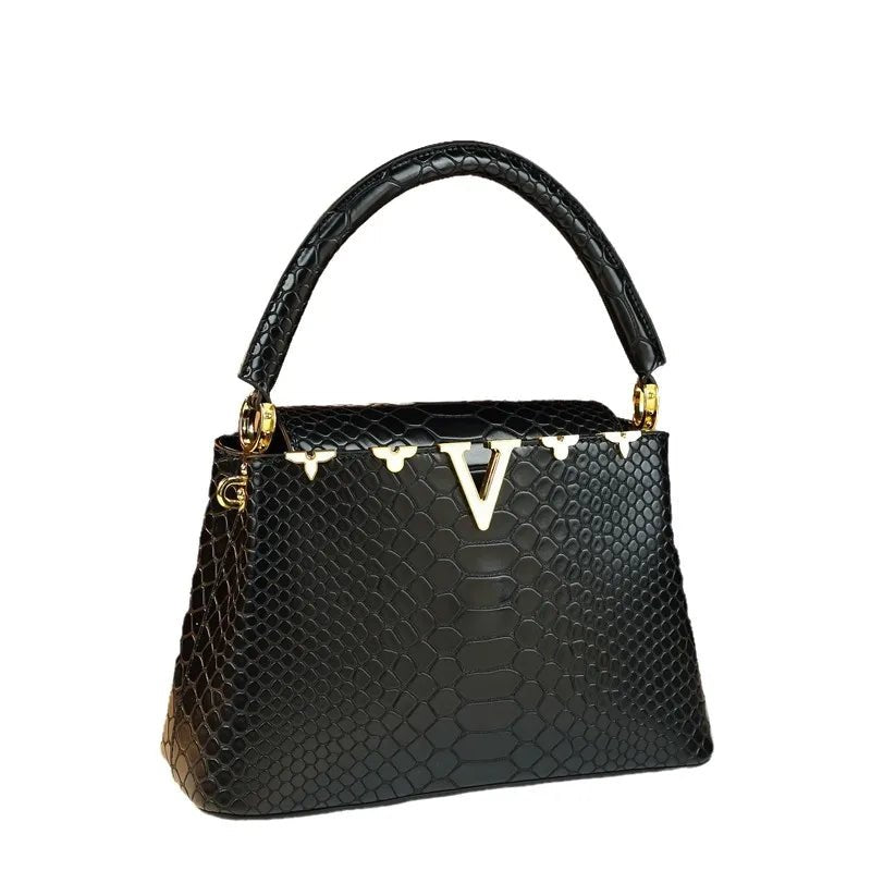 fashionable and versatile handbag with a high - end feel. It's a niche bag for middle - aged moms to carry diagonally - Kenner House Emporium
